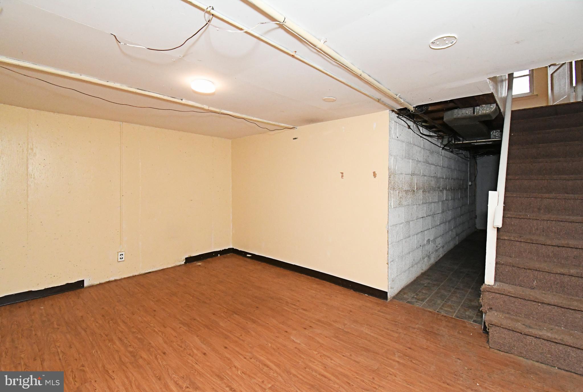 1107 East Sharpnack Street Philadelphia, PA 19150 - Photo 37 of 41 a view of an empty room with wooden floor