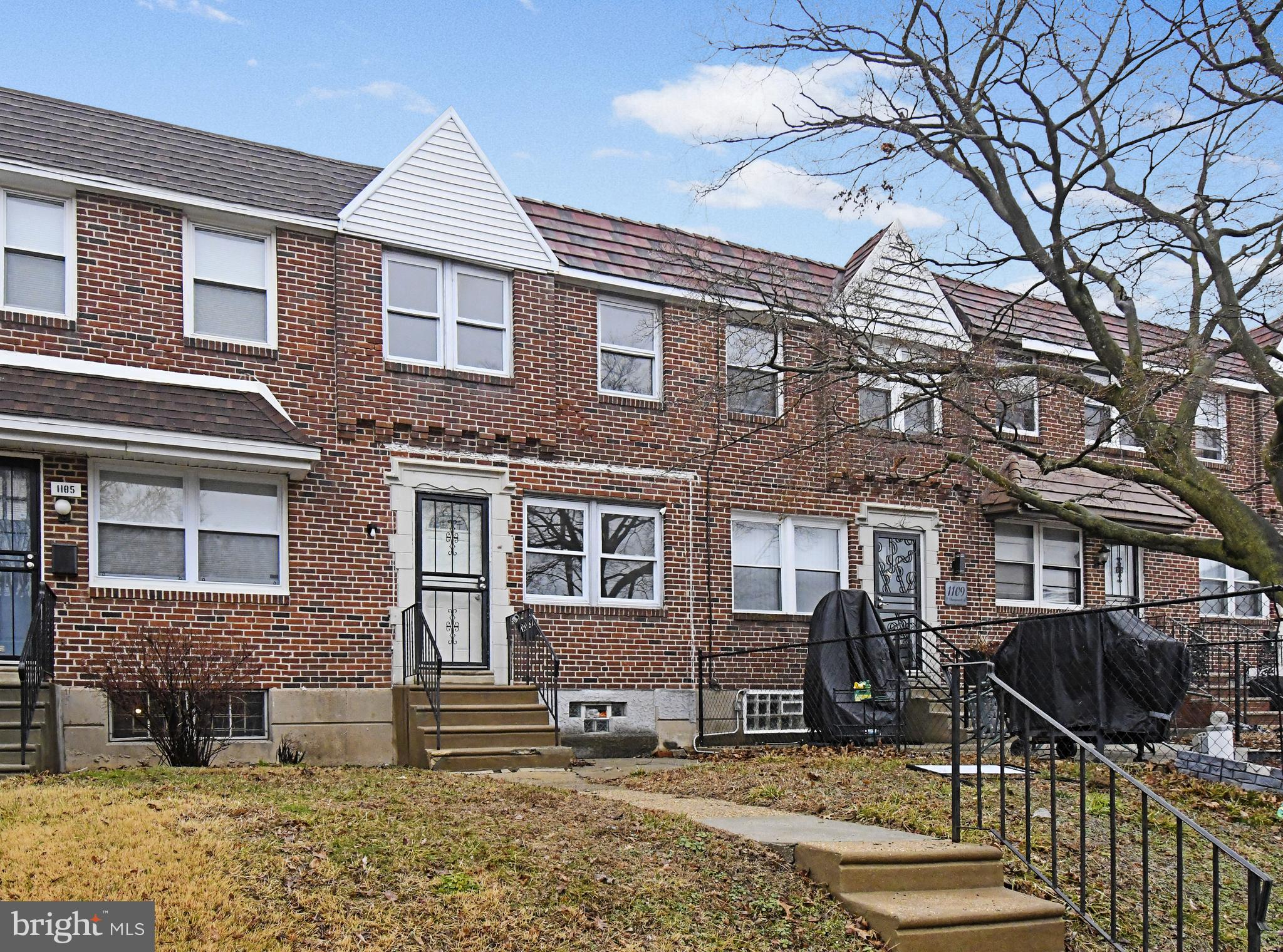 1107 East Sharpnack Street Philadelphia, PA 19150 - Photo 6 of 41 a front view of a house with parking space