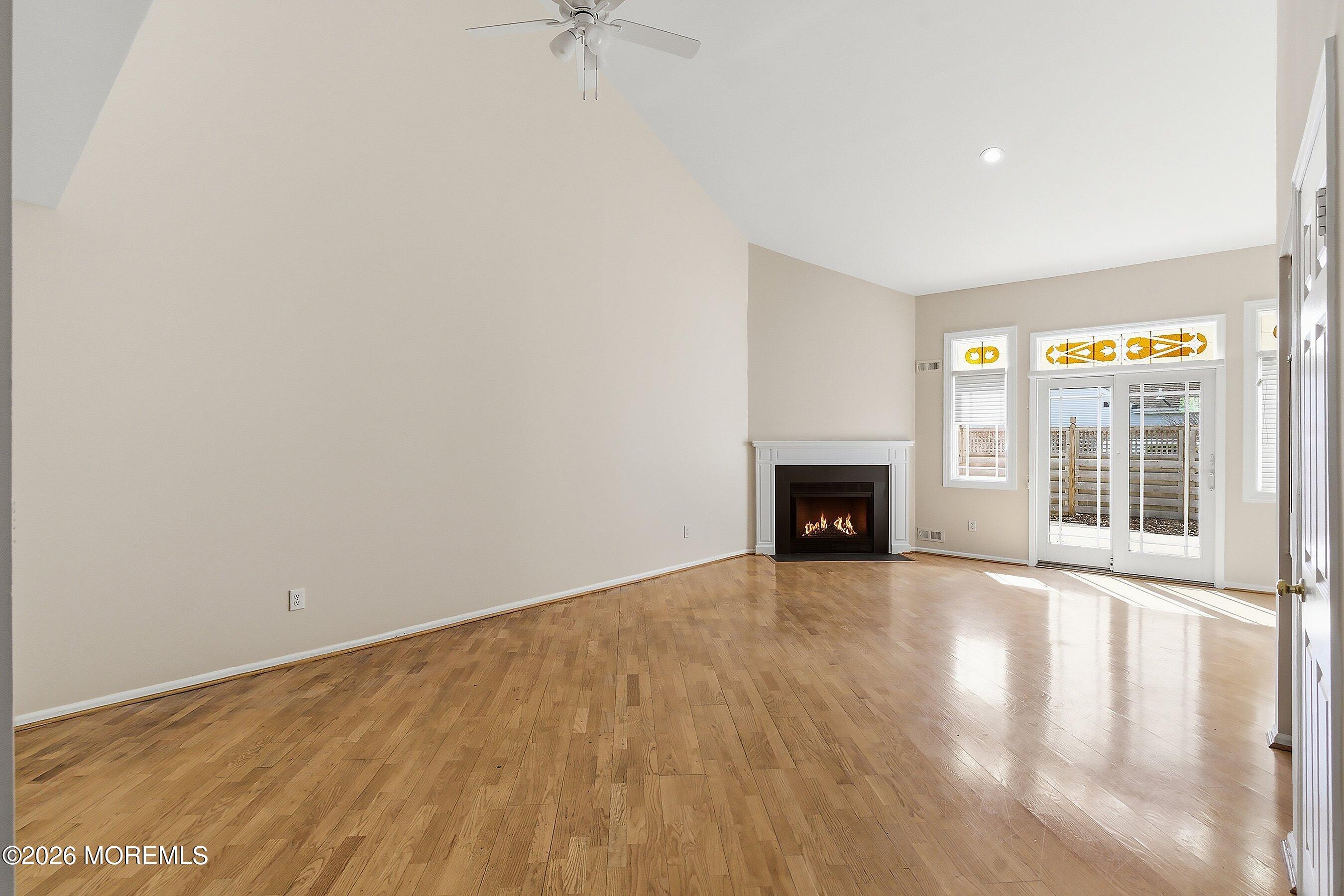 34 B Rutland Lane Monroe Township, NJ 08831 - Photo 11 of 46 a view of an empty room with a fireplace and a window
