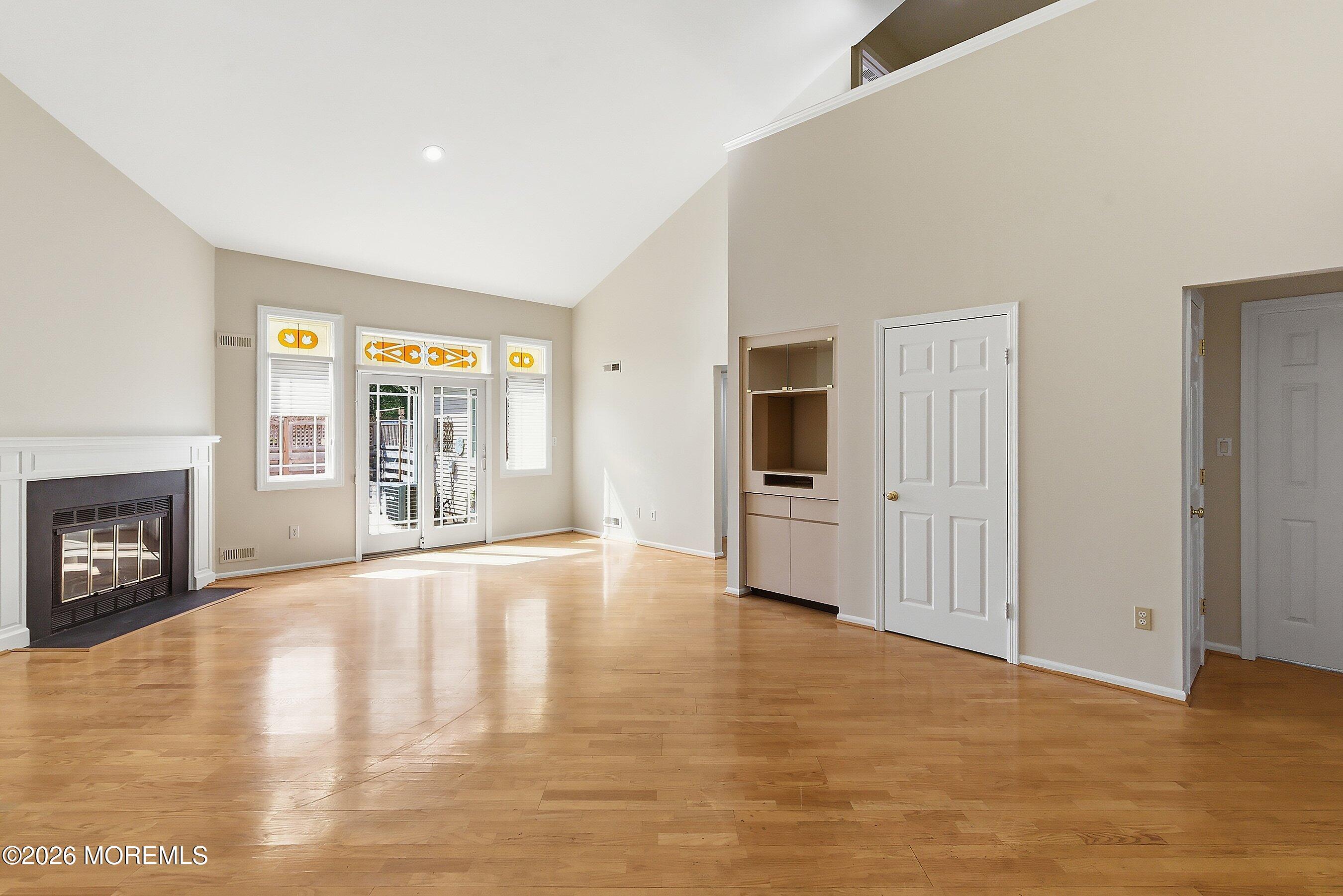 34 B Rutland Lane Monroe Township, NJ 08831 - Photo 12 of 46 a view of an empty room with a window and fireplace