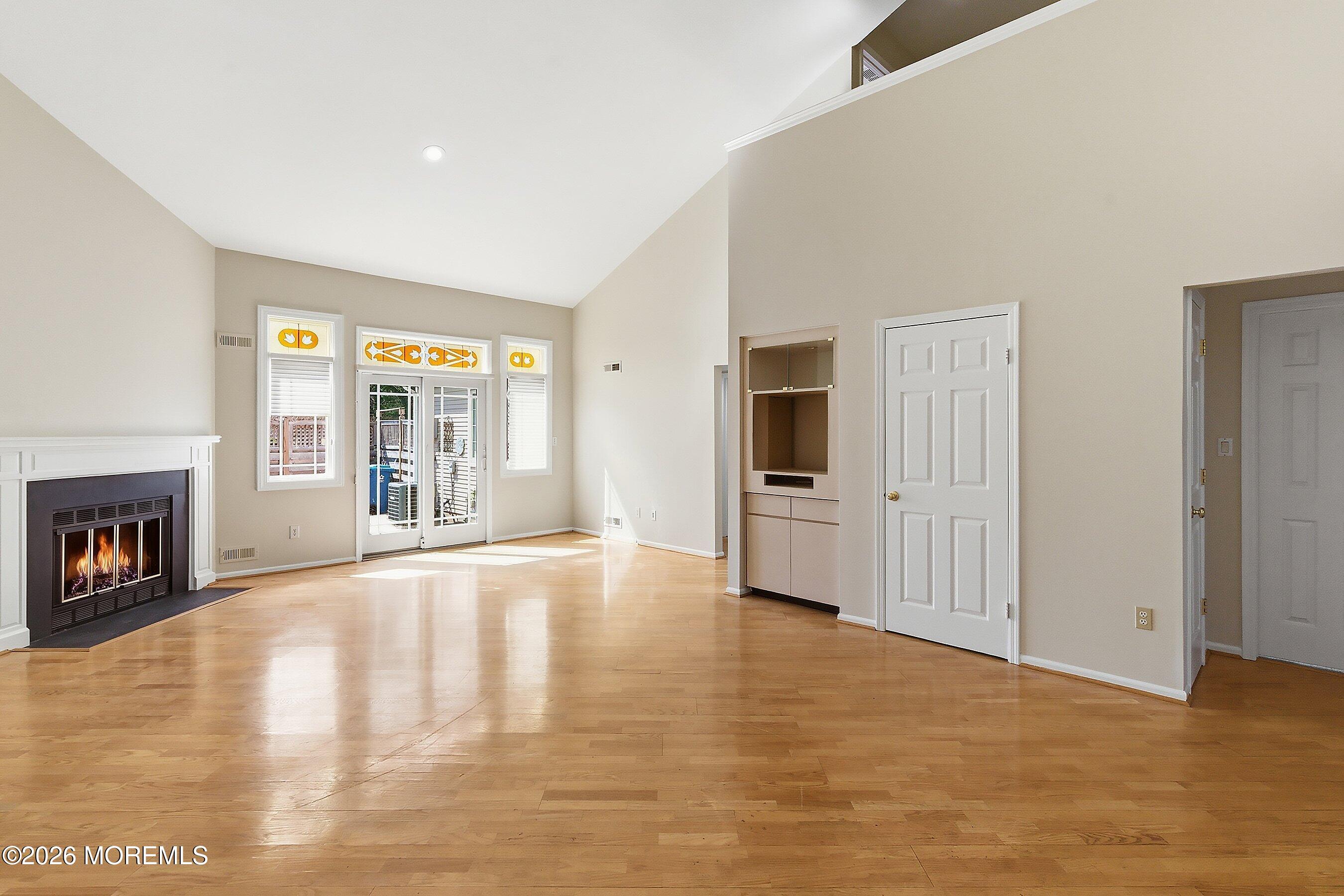 34 B Rutland Lane Monroe Township, NJ 08831 - Photo 13 of 46 a view of an empty room with a window and a kitchen
