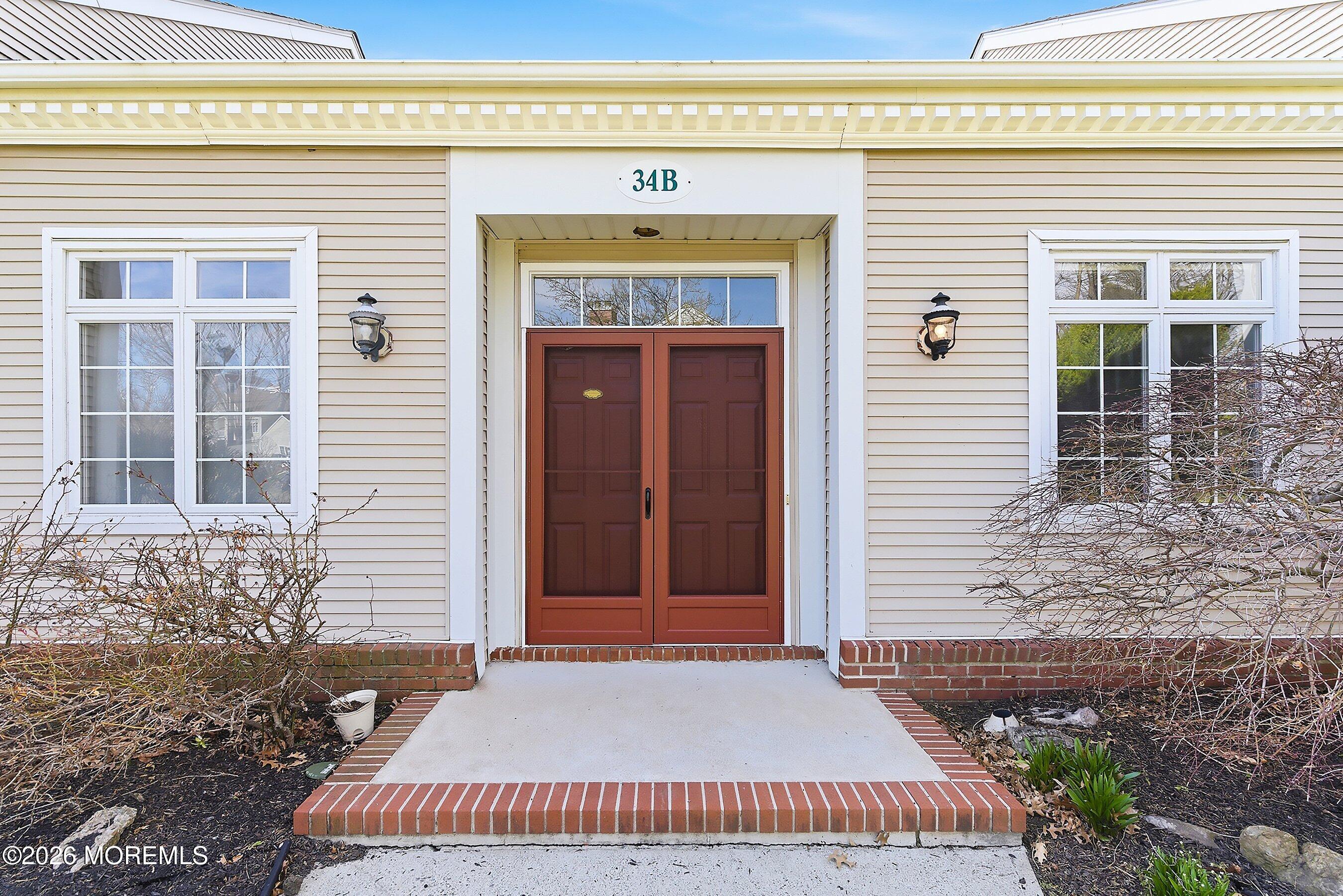 34 B Rutland Lane Monroe Township, NJ 08831 - Photo 2 of 46 a front view of a house with a yard