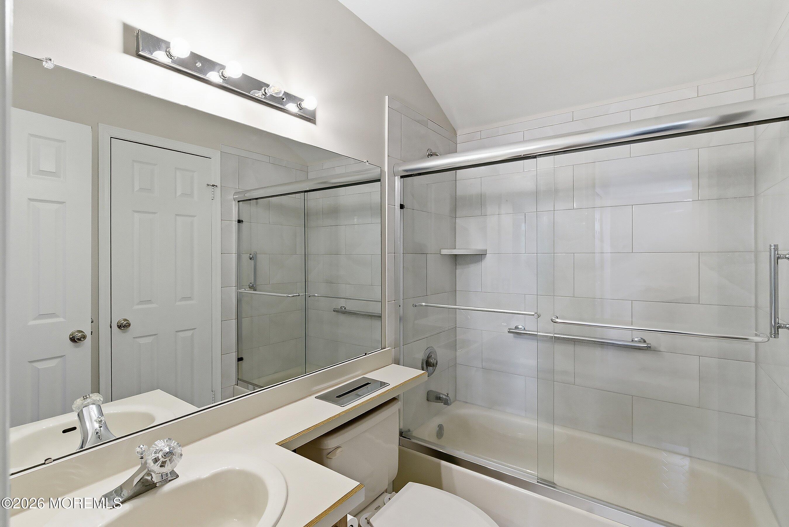 34 B Rutland Lane Monroe Township, NJ 08831 - Photo 22 of 46 a bathroom with a sink mirror and shower