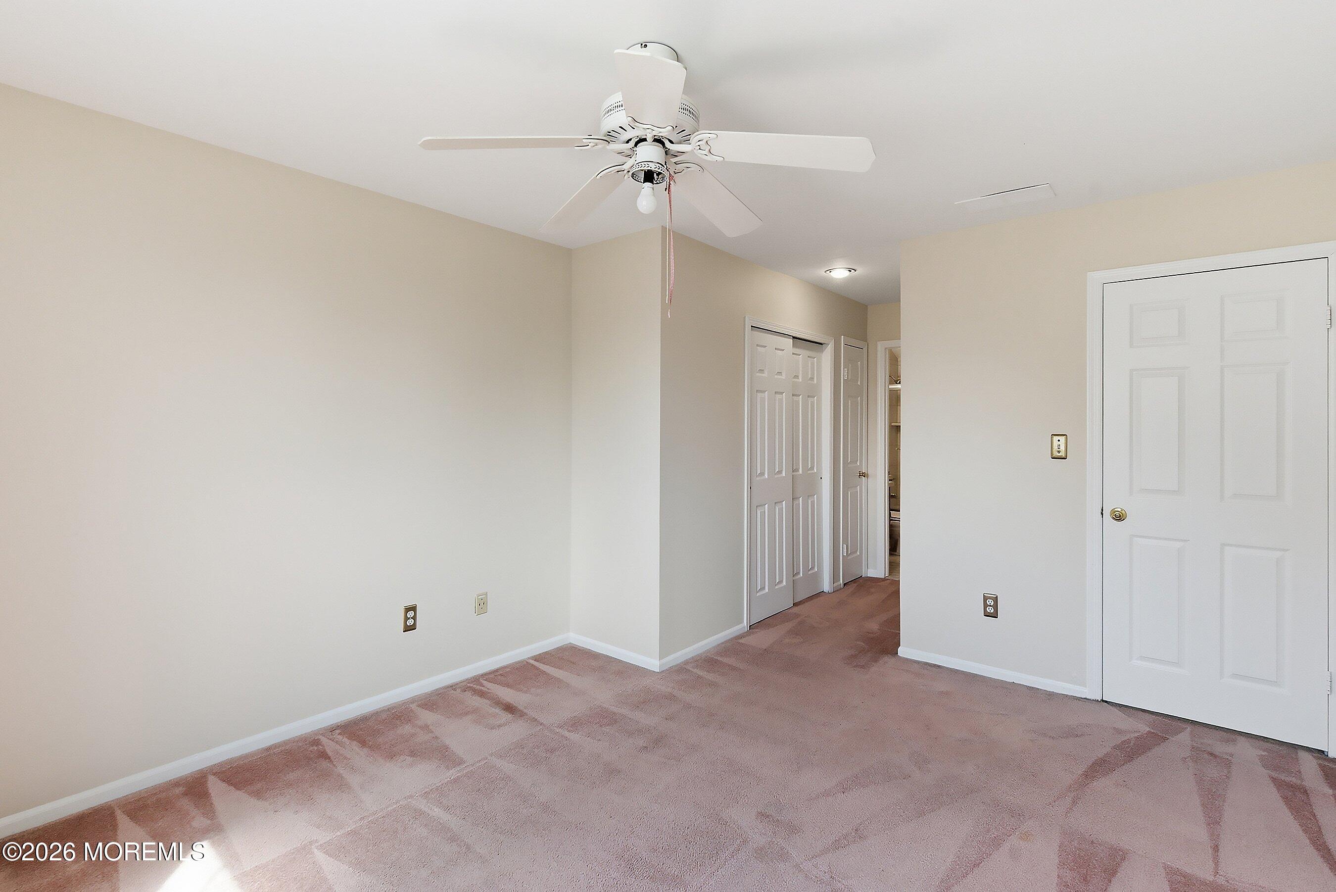 34 B Rutland Lane Monroe Township, NJ 08831 - Photo 23 of 46 a view of a big room with a chandelier fan