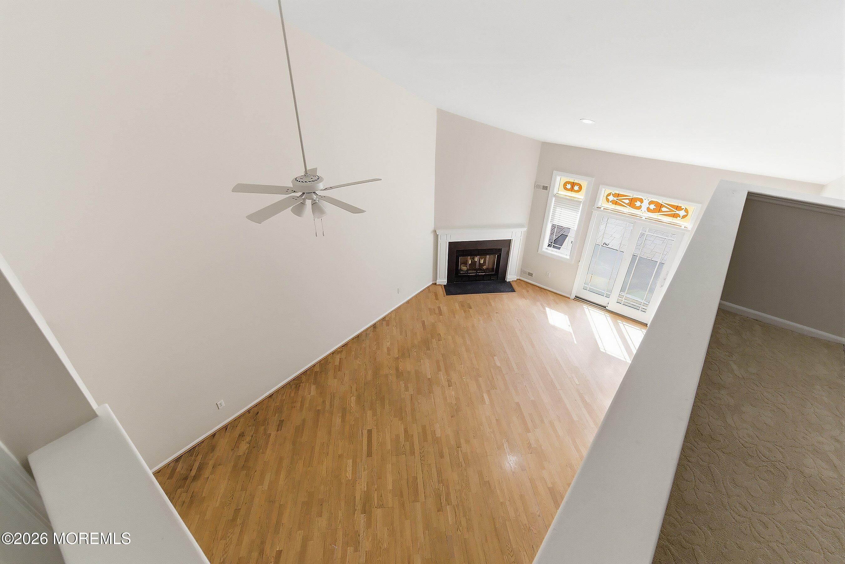 34 B Rutland Lane Monroe Township, NJ 08831 - Photo 25 of 46 a view of a livingroom with wooden floor
