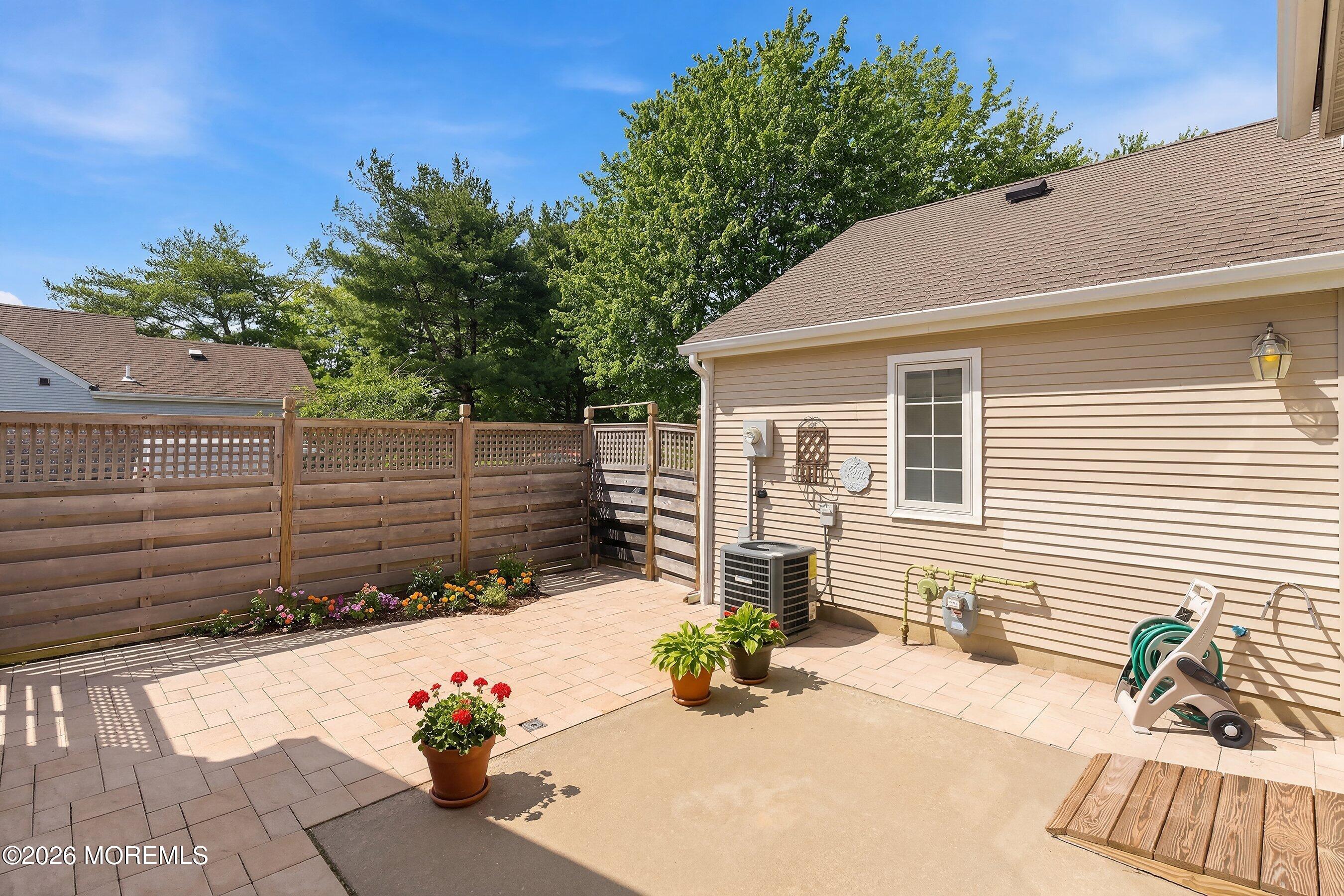 34 B Rutland Lane Monroe Township, NJ 08831 - Photo 28 of 46 a view of a chairs and table in the back yard
