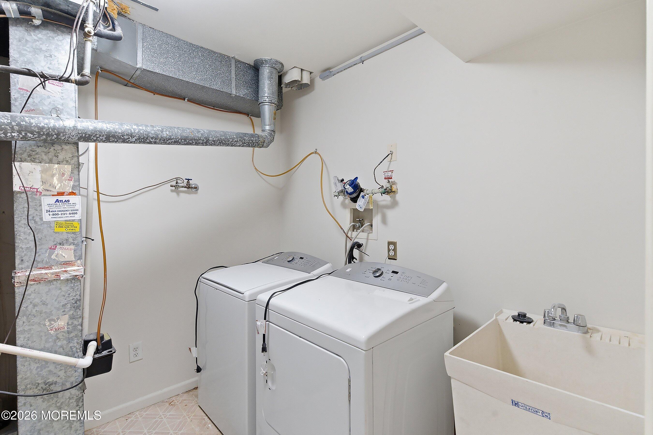 34 B Rutland Lane Monroe Township, NJ 08831 - Photo 29 of 46 a utility room with dryer and washer