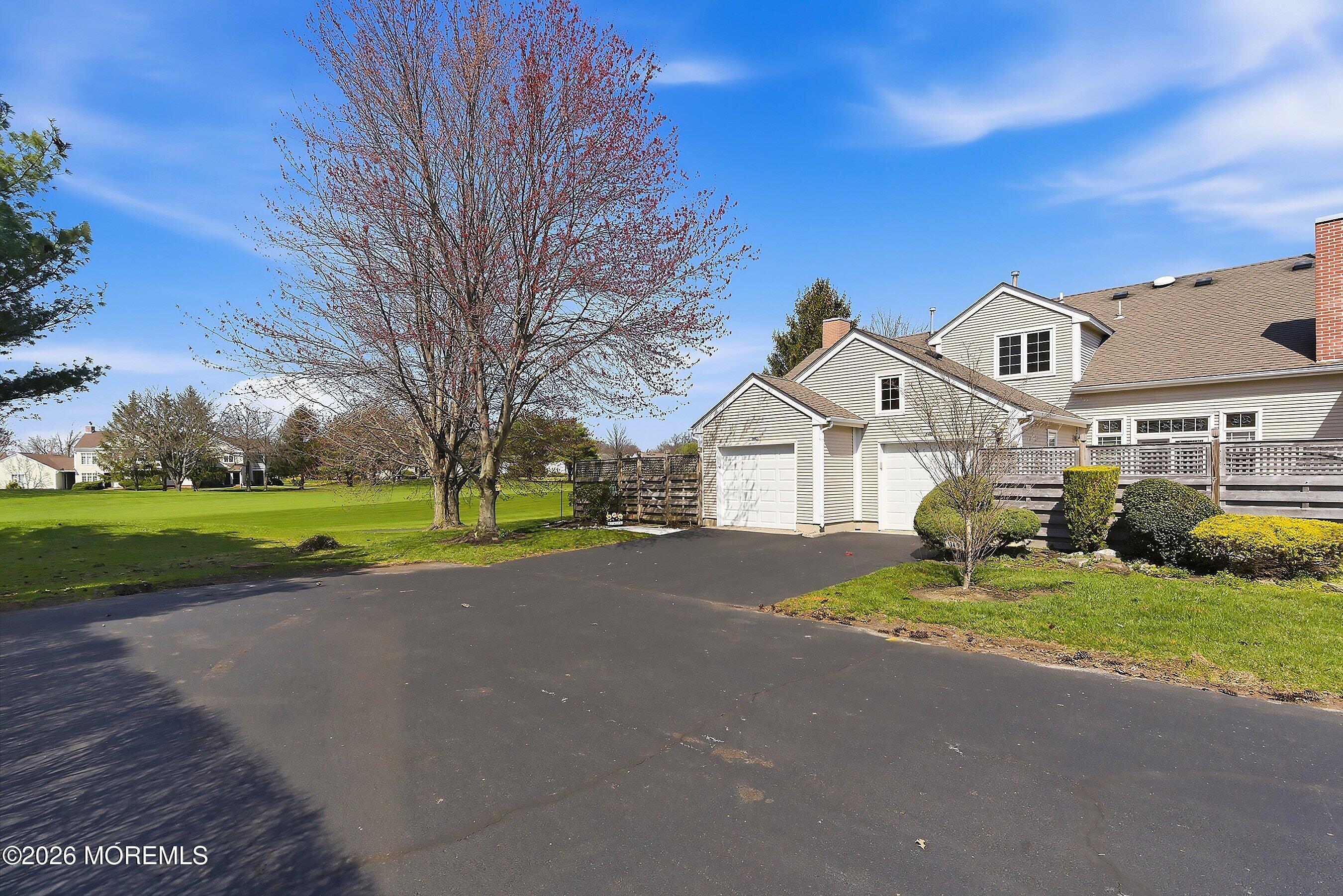 34 B Rutland Lane Monroe Township, NJ 08831 - Photo 3 of 46 a view of a house with a big yard and large trees