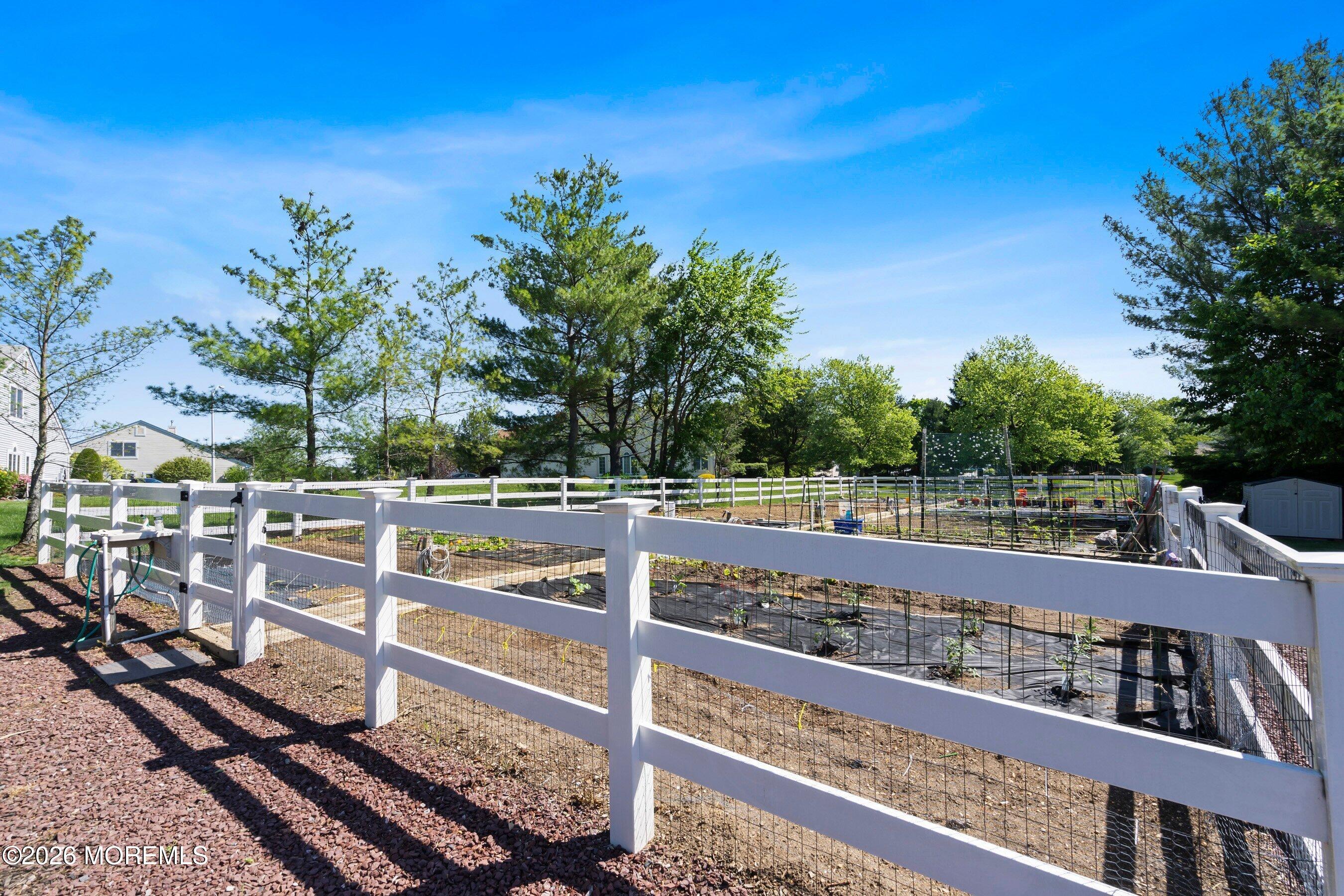 34 B Rutland Lane Monroe Township, NJ 08831 - Photo 42 of 46 a view of a balcony with wooden floor and fence