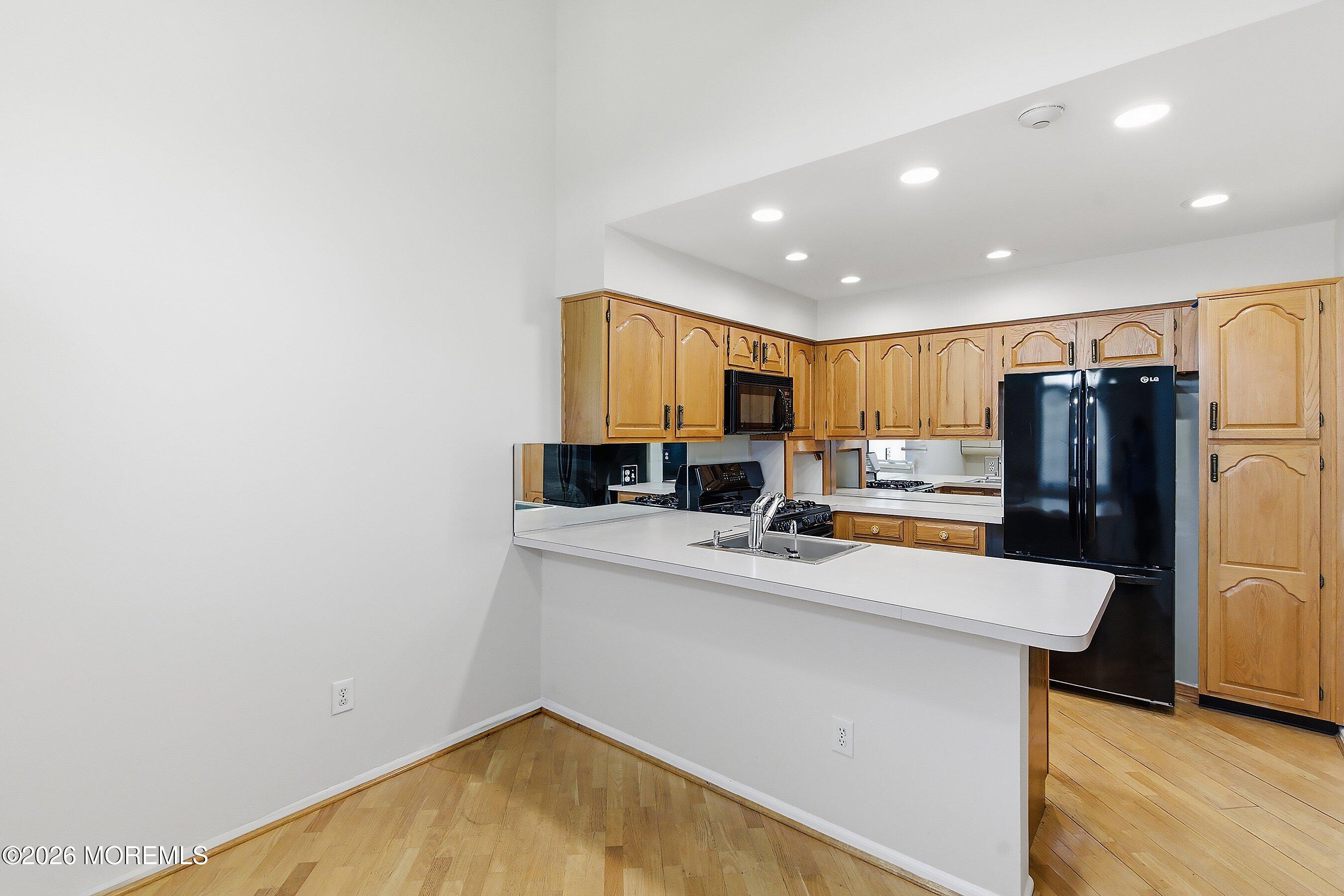 34 B Rutland Lane Monroe Township, NJ 08831 - Photo 7 of 46 a kitchen with refrigerator and a stove