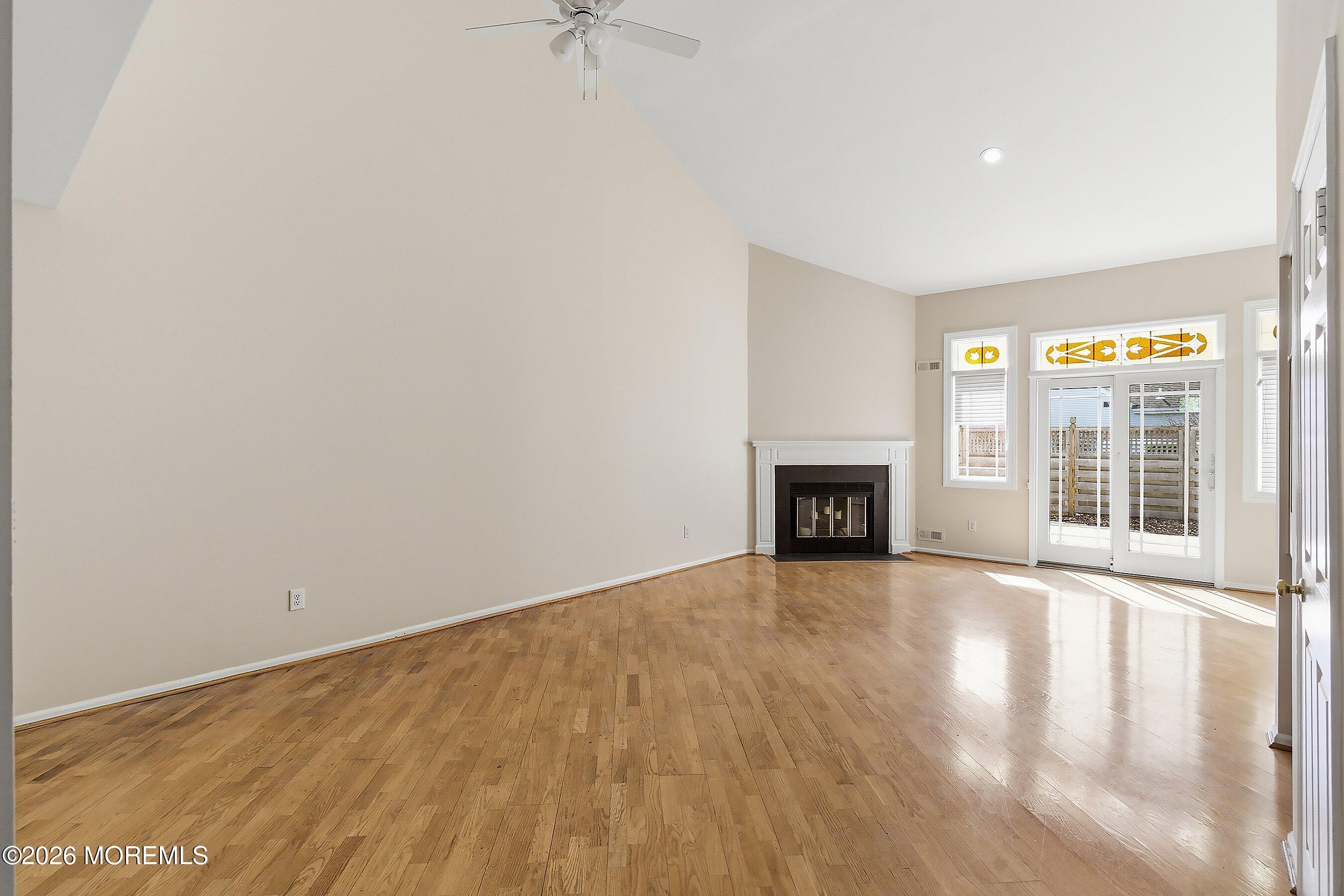 34 B Rutland Lane Monroe Township, NJ 08831 - Photo 10 of 46 a view of an empty room with a fireplace and a window