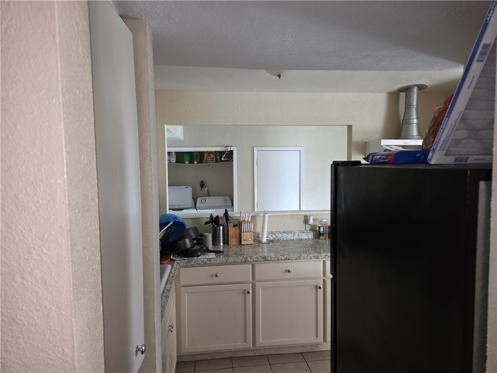 4845 Monitor Street Corpus Christi, TX 78415 - Photo 13 of 16 a kitchen with a refrigerator and a sink
