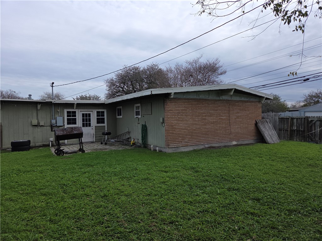 4845 Monitor Street Corpus Christi, TX 78415 - Photo 15 of 16 a backyard of a house with table and chairs