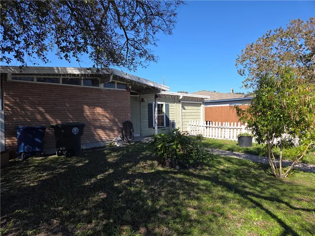 a view of a house with a small yard