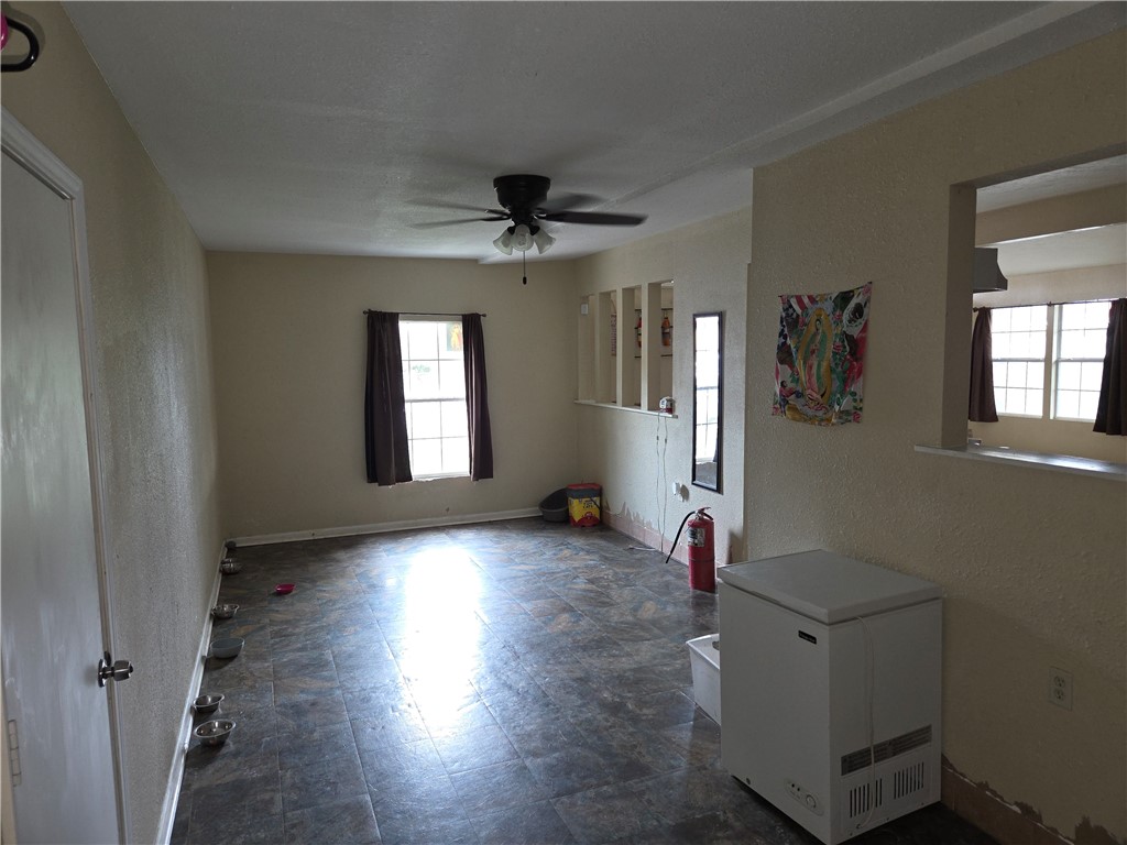 4845 Monitor Street Corpus Christi, TX 78415 - Photo 8 of 16 wooden floor in an empty room with a window