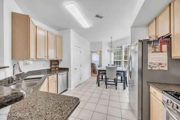 $869,000 | 155 Point Of Woods Boulevard, Morganville, NJ 07751