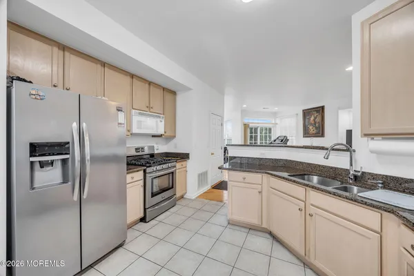 $869,000 | 155 Point Of Woods Boulevard, Morganville, NJ 07751