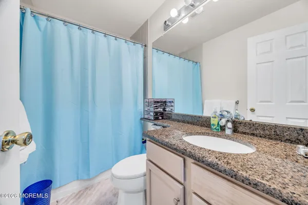 $869,000 | 155 Point Of Woods Boulevard, Morganville, NJ 07751