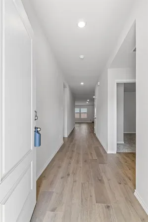 an empty room with wooden floor