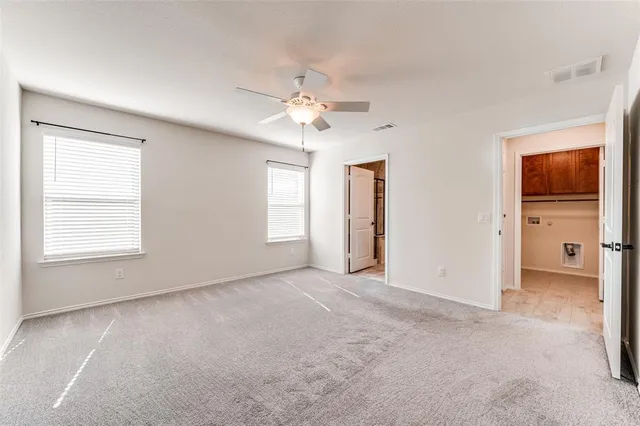 a kitchen with granite countertop a sink a counter space appliances and cabinets