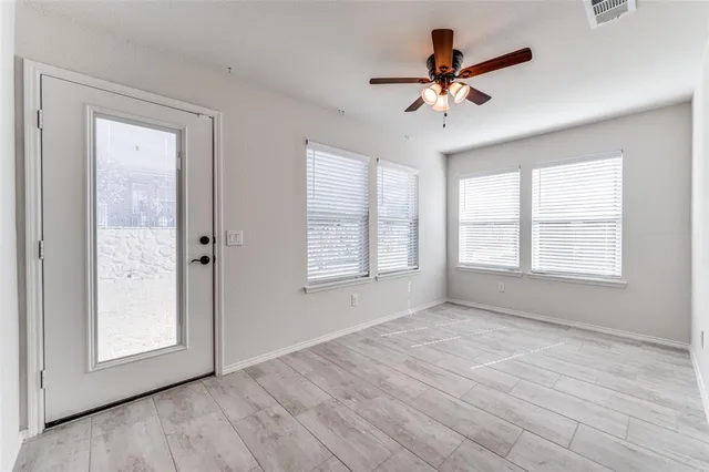 a view of an empty room with a window
