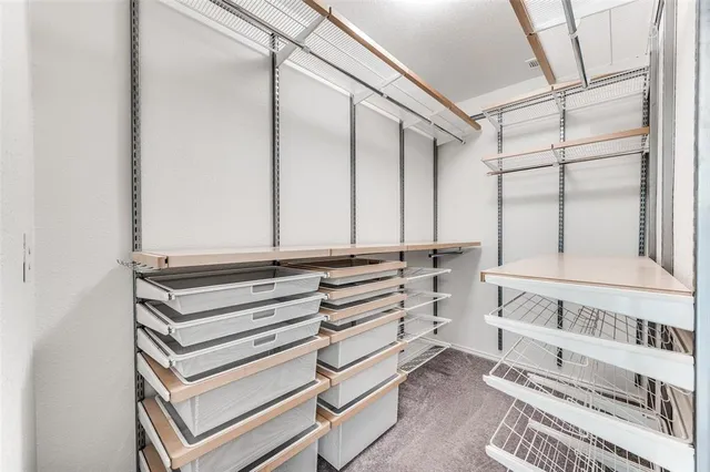 a view of bedroom with stairs and white walls