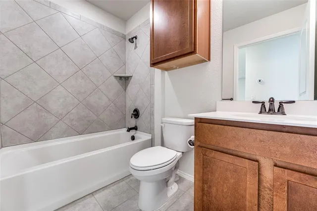 a bathroom with a sink a toilet and a bathtub