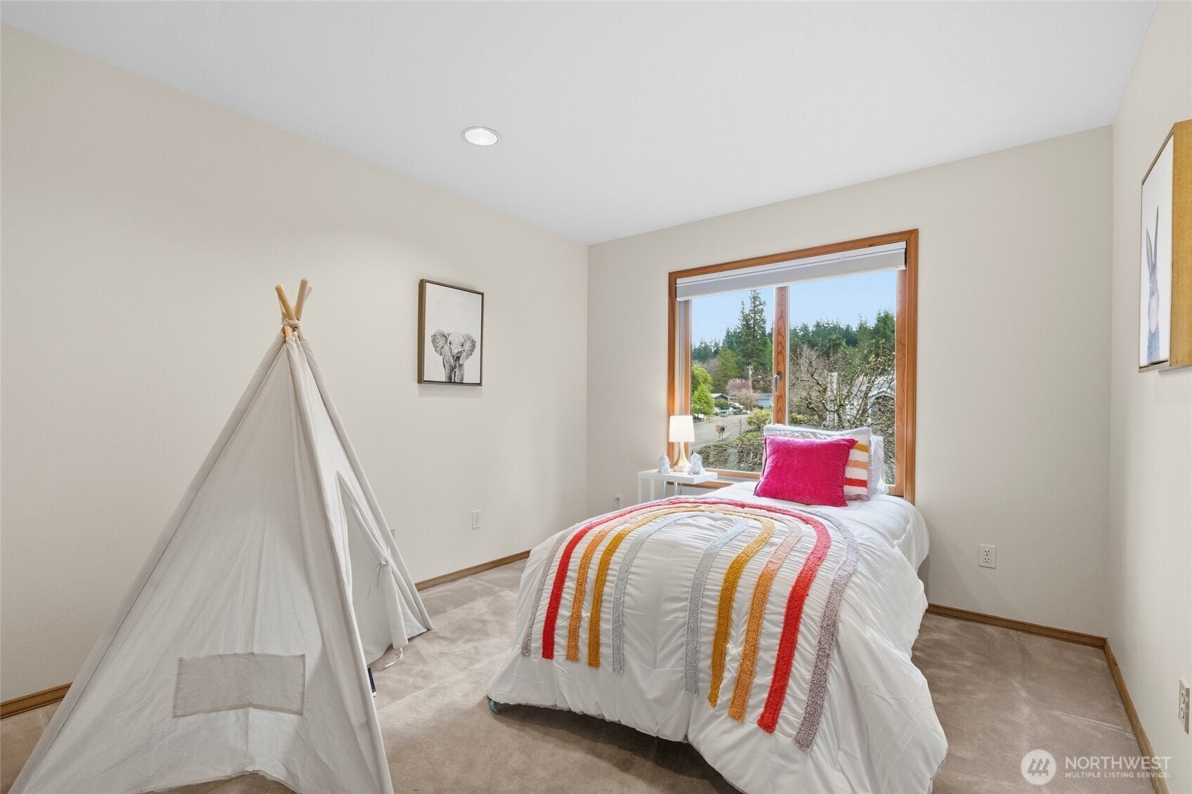 7810 175th Street Southwest Edmonds, WA 98026 - Photo 21 of 35 a bed sitting in a bedroom next to a window