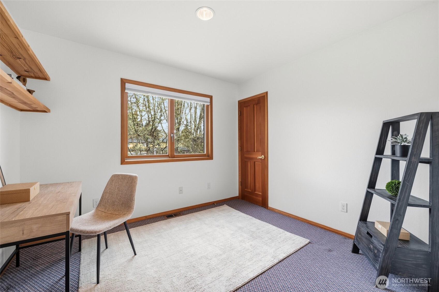 7810 175th Street Southwest Edmonds, WA 98026 - Photo 23 of 35 a view of an empty room with furniture and a window