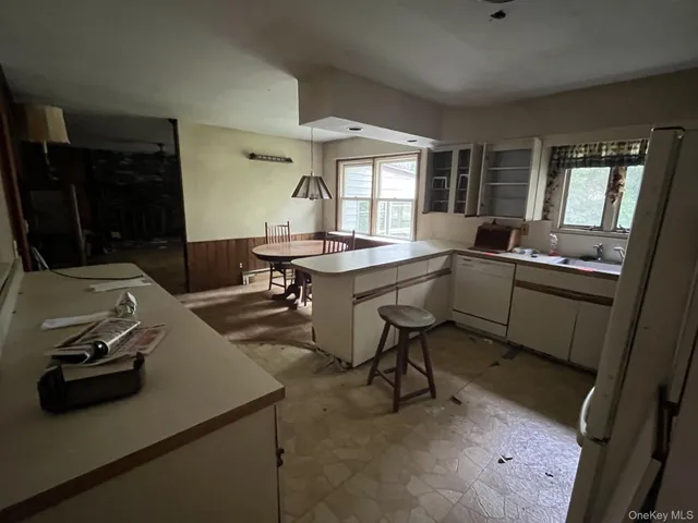 a view of a kitchen area with furniture and window
