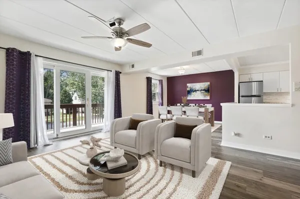 a living room with furniture and a large window