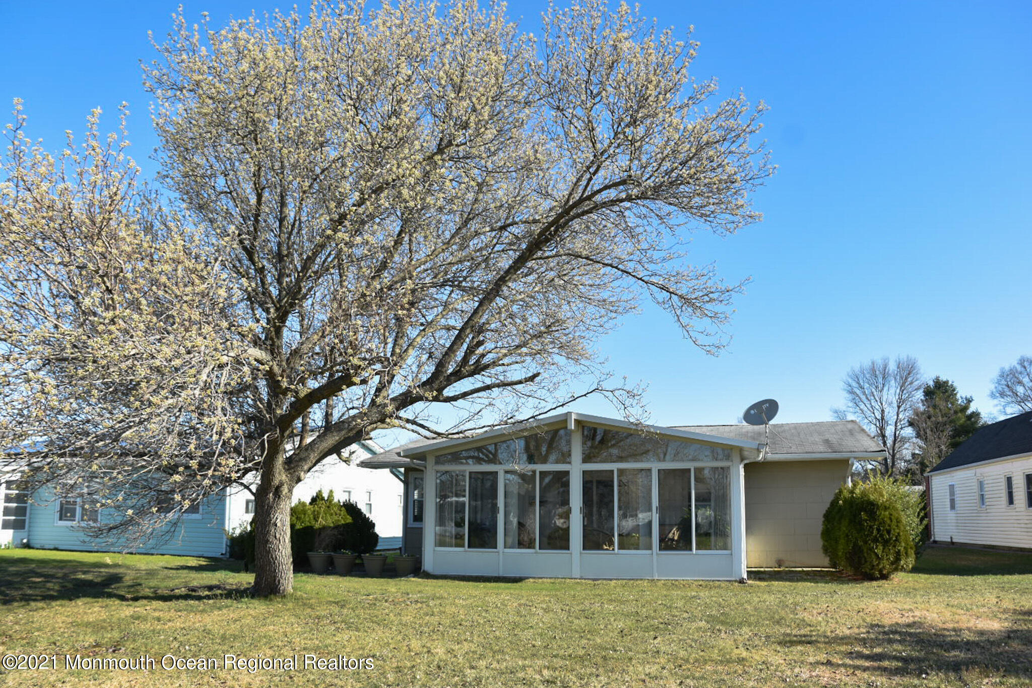 146 Clay Circle Brick, NJ 08724 - Photo 17 of 20 a front view of a house with a garden