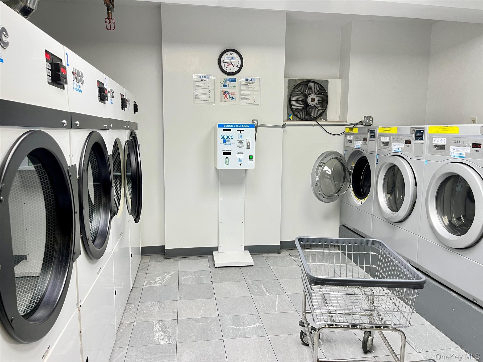 142-15 Franklin Avenue, Unit 3F Queens, NY 11355 - Photo 13 of 15 Shared laundry with independent washer and dryer and baseboards