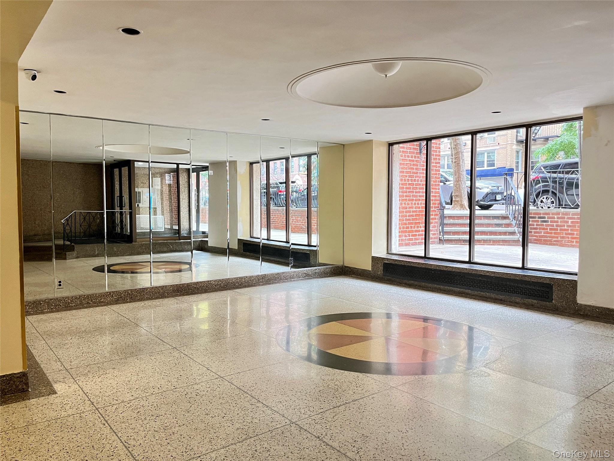 142-15 Franklin Avenue, Unit 3F Queens, NY 11355 - Photo 14 of 15 Building lobby with floor to ceiling windows