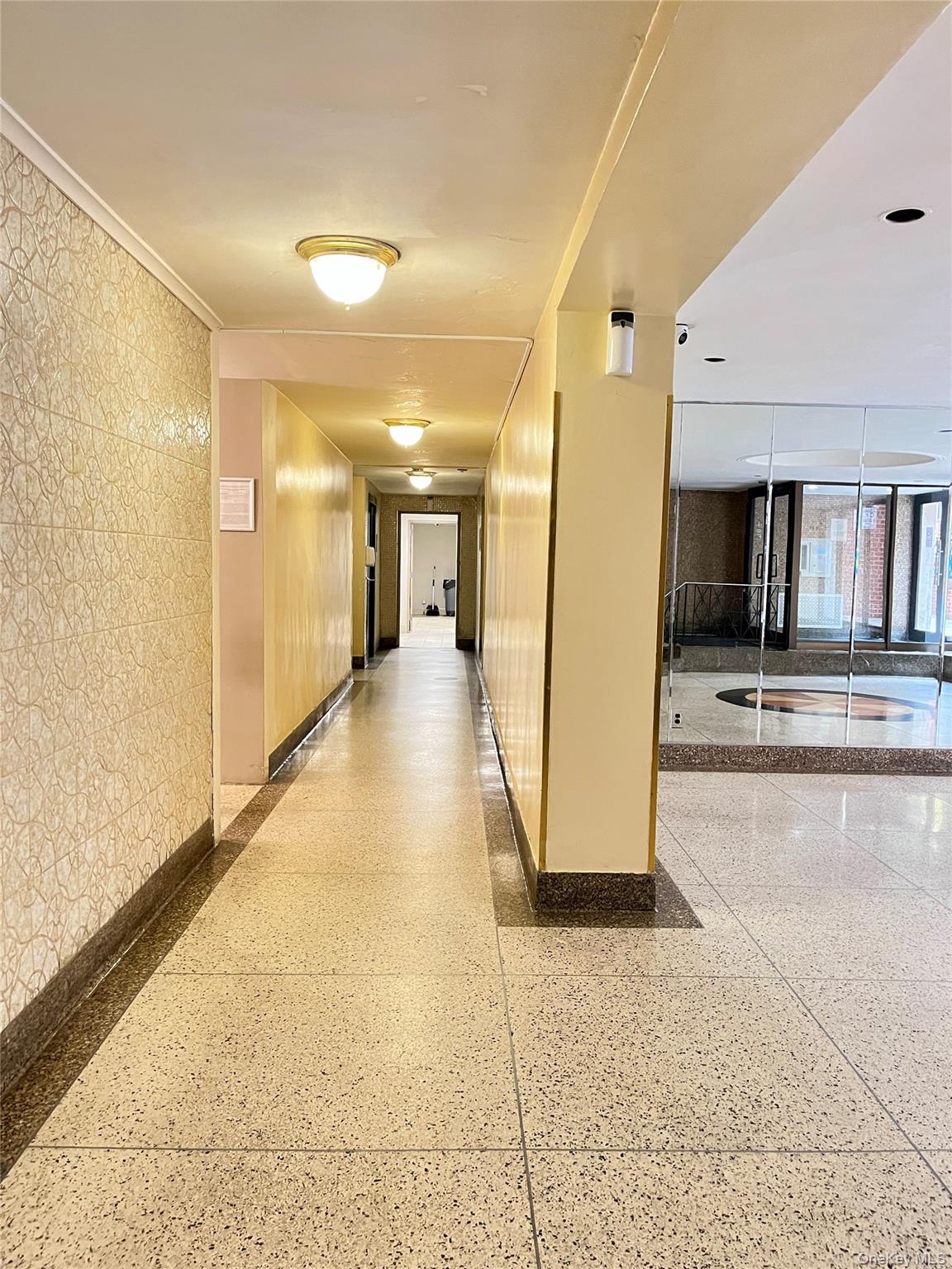 142-15 Franklin Avenue, Unit 3F Queens, NY 11355 - Photo 15 of 15 Hall with dark speckled floor