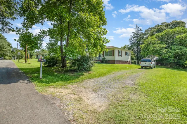 a view of a house with a backyard porch and sitting area