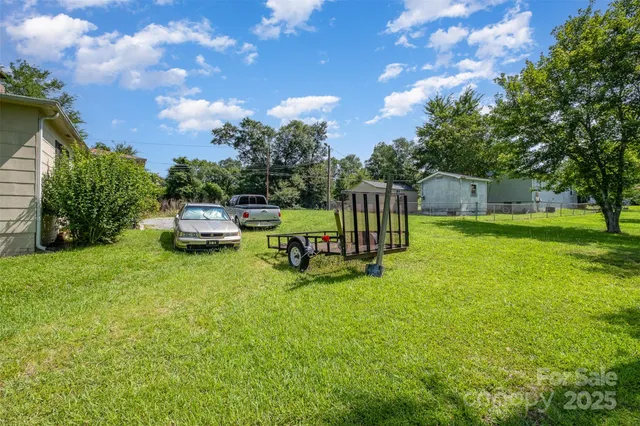 a house view with a sitting space and garden