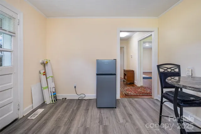 a view of a livingroom with furniture and wooden floor