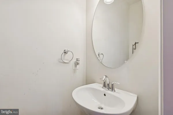 a bathroom with a sink and mirror