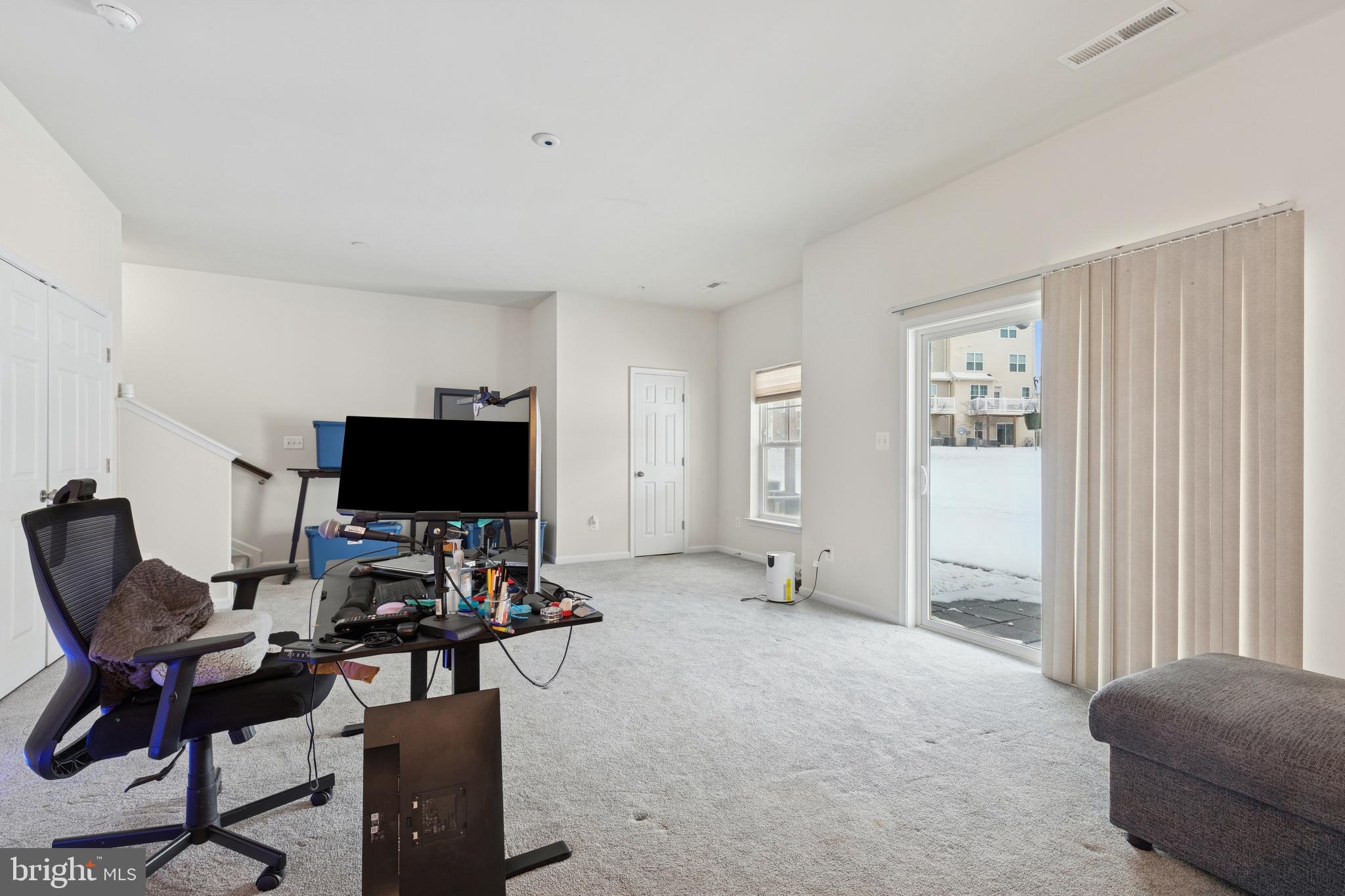 5857 Bella Marie Way, Unit F Frederick, MD 21703 - Photo 13 of 45 a living room with furniture and a flat screen tv