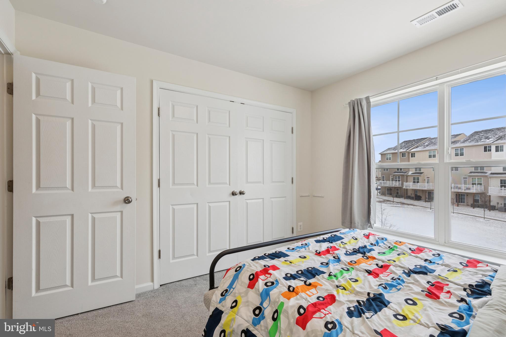 5857 Bella Marie Way, Unit F Frederick, MD 21703 - Photo 21 of 45 a bedroom with a bed and a window