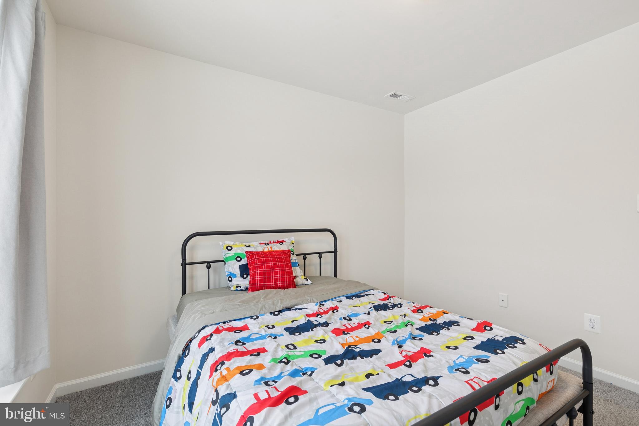 5857 Bella Marie Way, Unit F Frederick, MD 21703 - Photo 22 of 45 a bedroom with a bed and a dresser