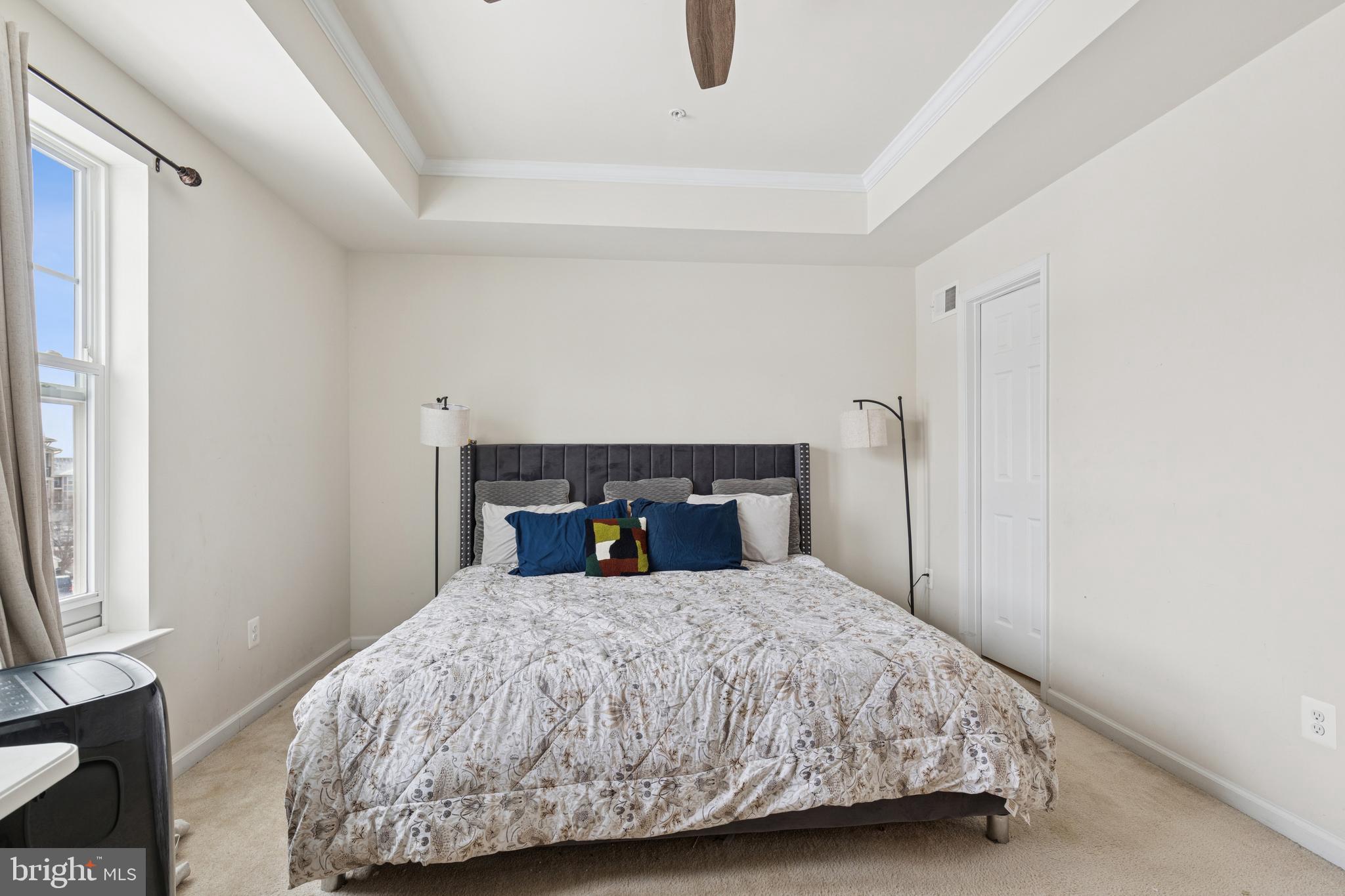 5857 Bella Marie Way, Unit F Frederick, MD 21703 - Photo 25 of 45 a bedroom with a bed and window
