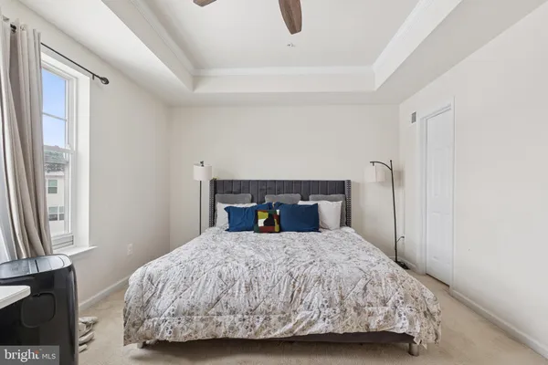 a bedroom with a bed and window