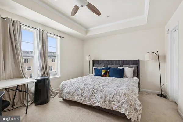 a bedroom with a large bed and a dresser