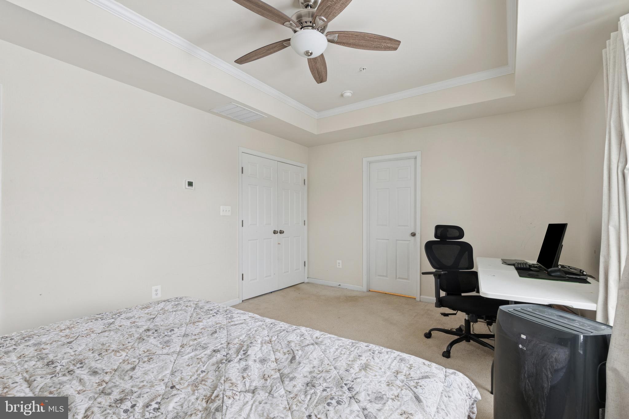 5857 Bella Marie Way, Unit F Frederick, MD 21703 - Photo 28 of 45 a bedroom with a workspace