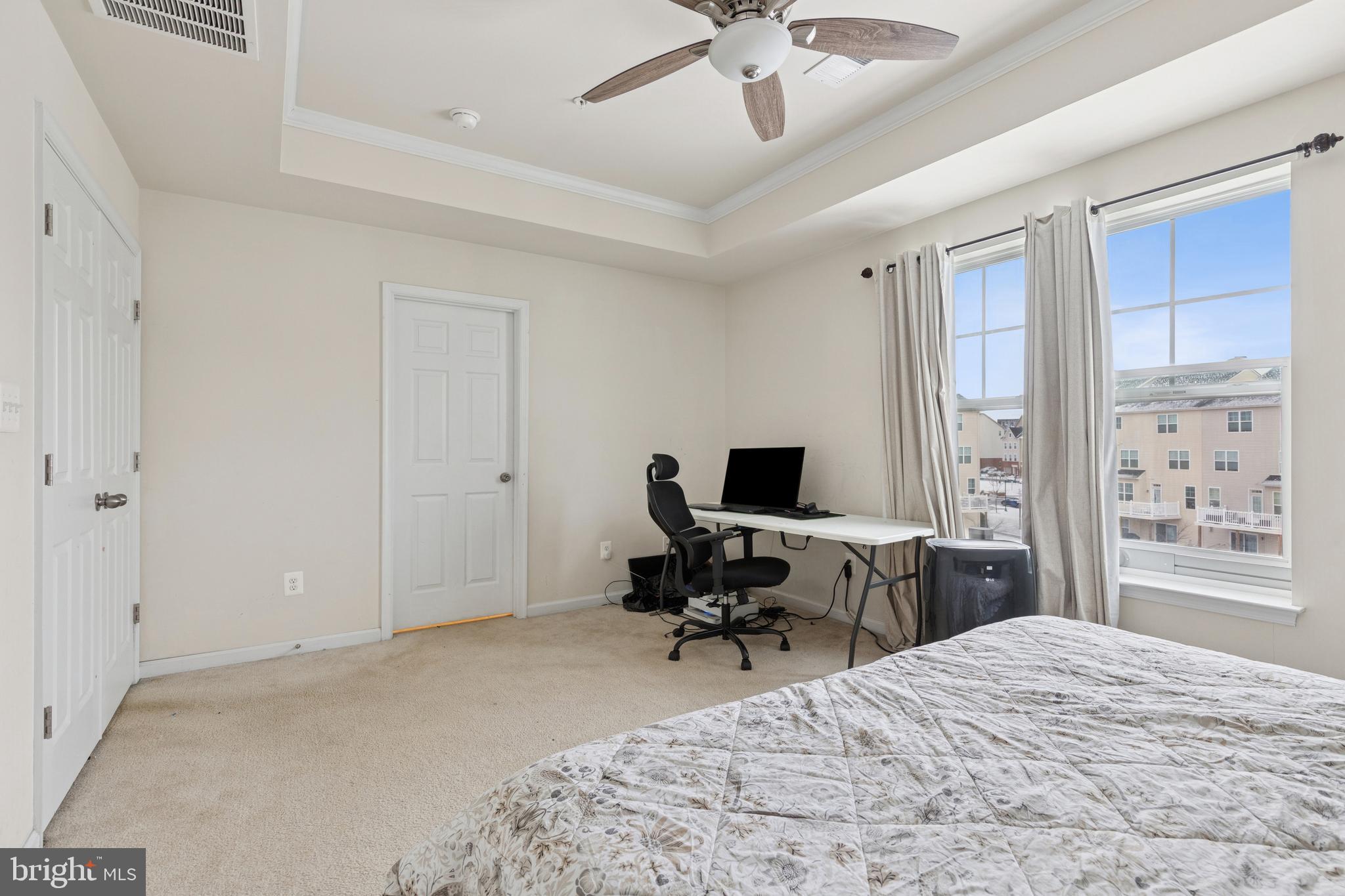 5857 Bella Marie Way, Unit F Frederick, MD 21703 - Photo 29 of 45 a view of a bedroom with workspace and a window