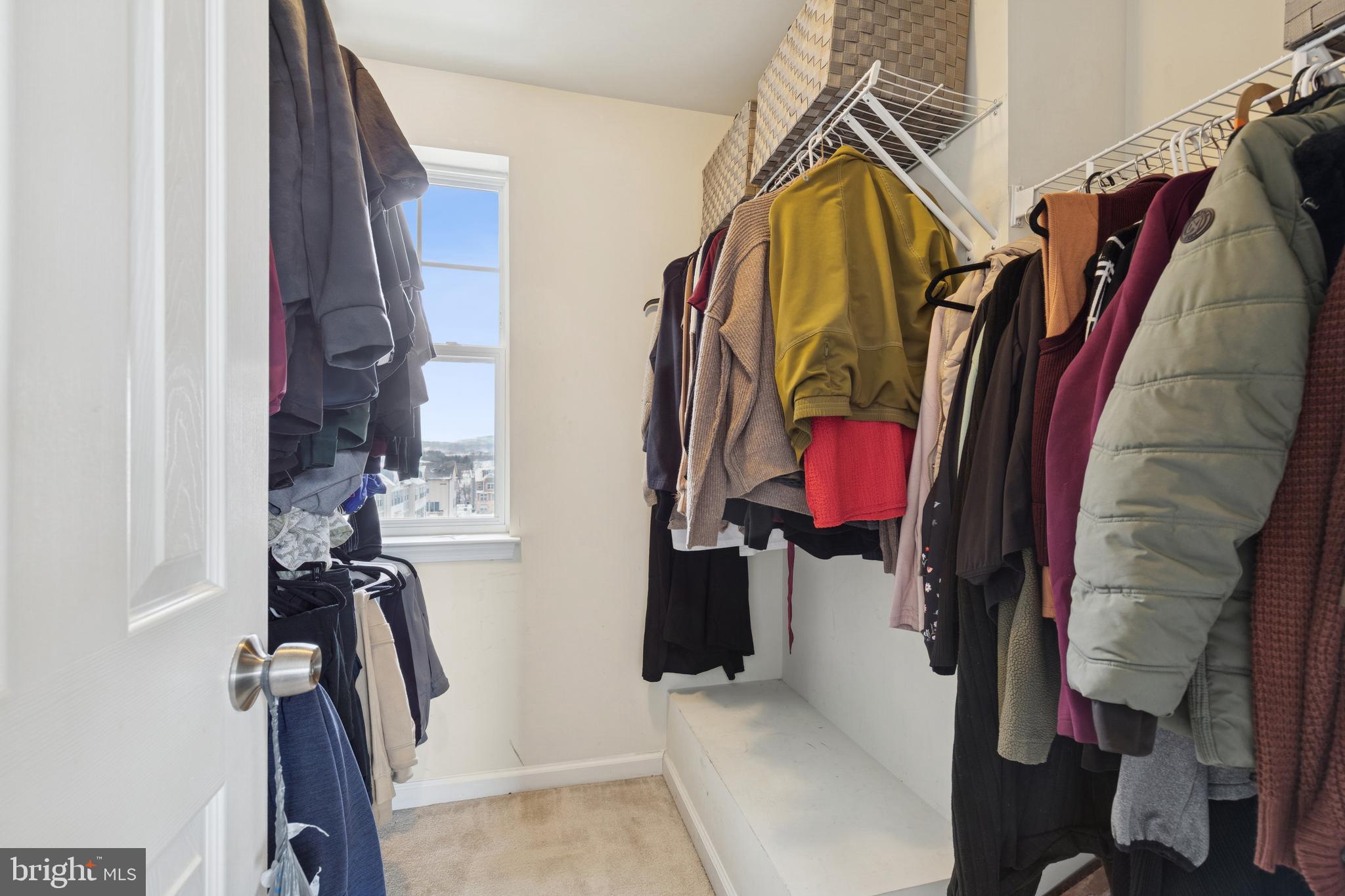 5857 Bella Marie Way, Unit F Frederick, MD 21703 - Photo 30 of 45 a view of walk in closet with clothes and shoes