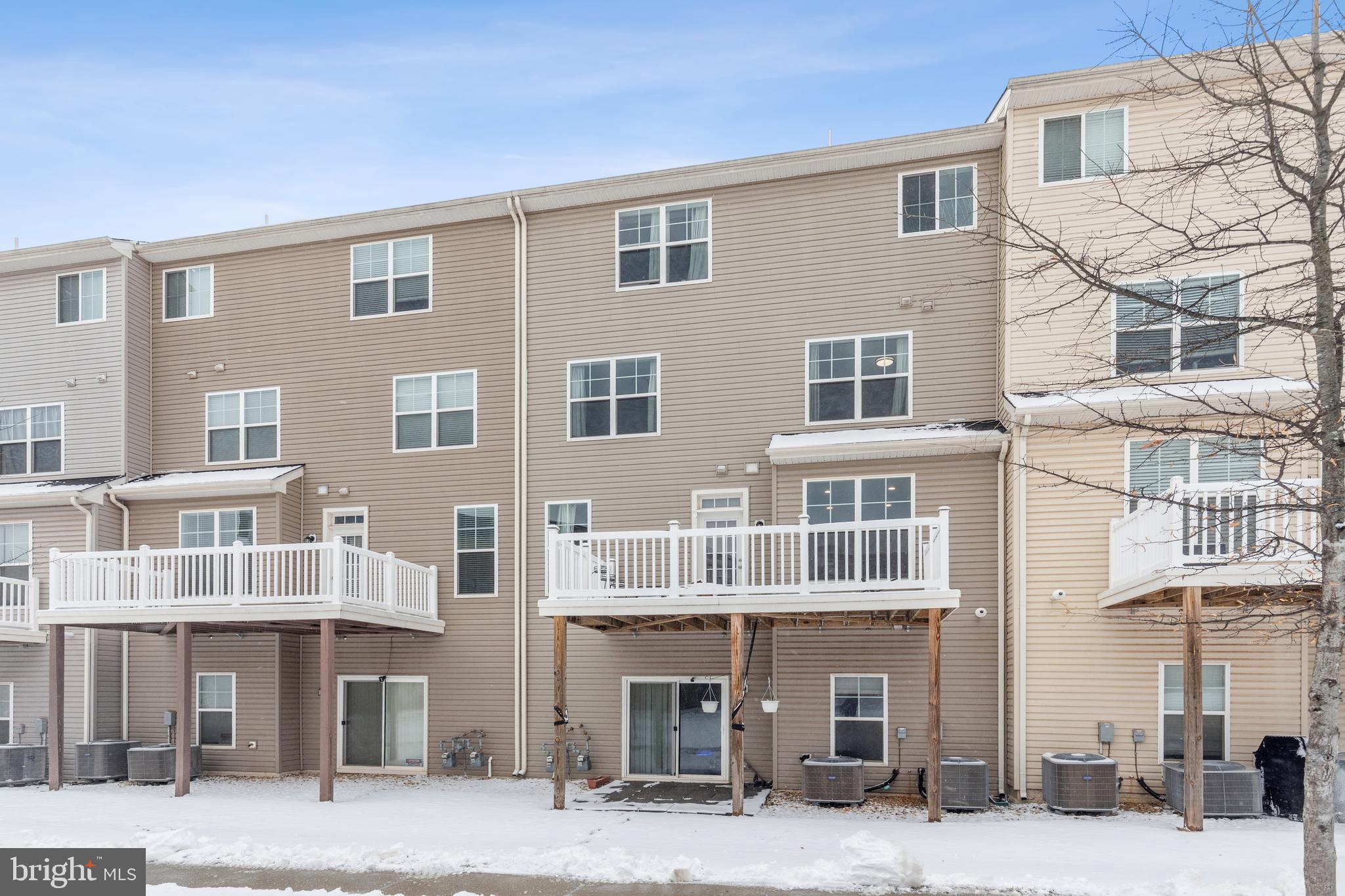 5857 Bella Marie Way, Unit F Frederick, MD 21703 - Photo 45 of 45 a front view of a building with many windows