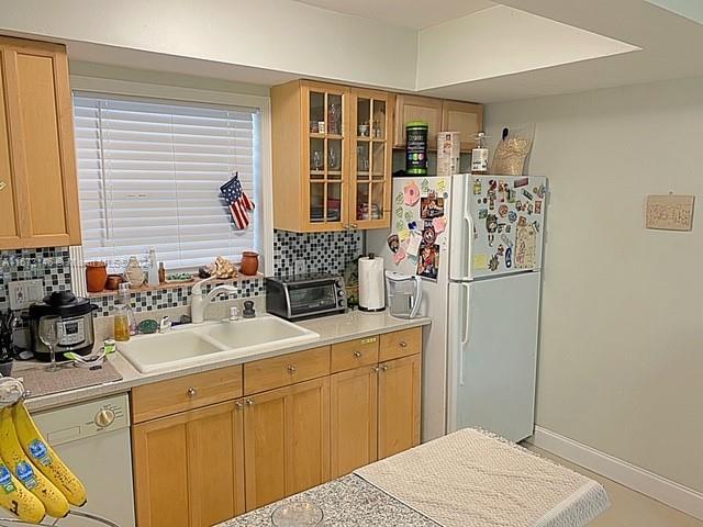 7580 Southwest 82nd Street, Unit F217 Miami, FL 33143 - Photo 2 of 14 a kitchen with a refrigerator and a sink